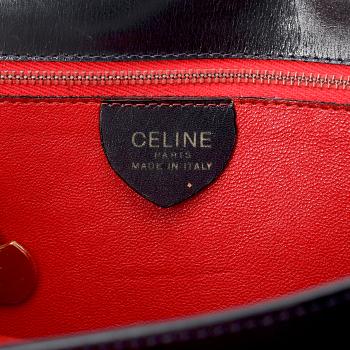 CÈLINE,  a navyblue leather handbag.