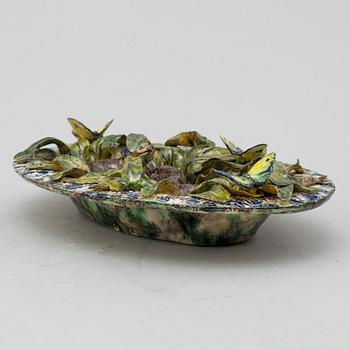 A richly decorated Palissy-style majolica plate, 19th century.