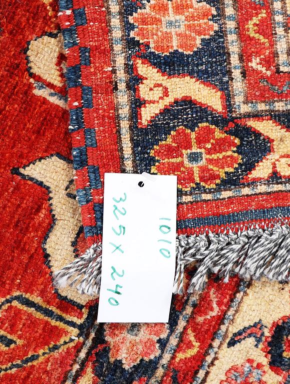 A Kazak carpet, c. 325 x 240 cm.