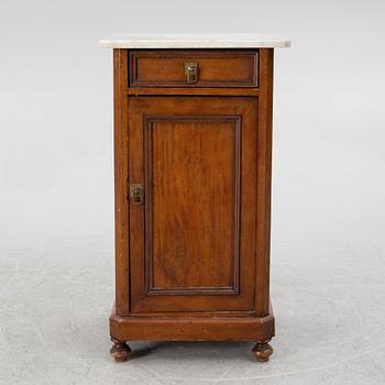 A bedside table, circa 1900.