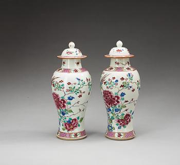 A pair of famille rose vases with covers, Qing dynasty (1736-95).