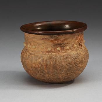 A brown and black glazed rice measurement cup, Song dynasty (960-1279).