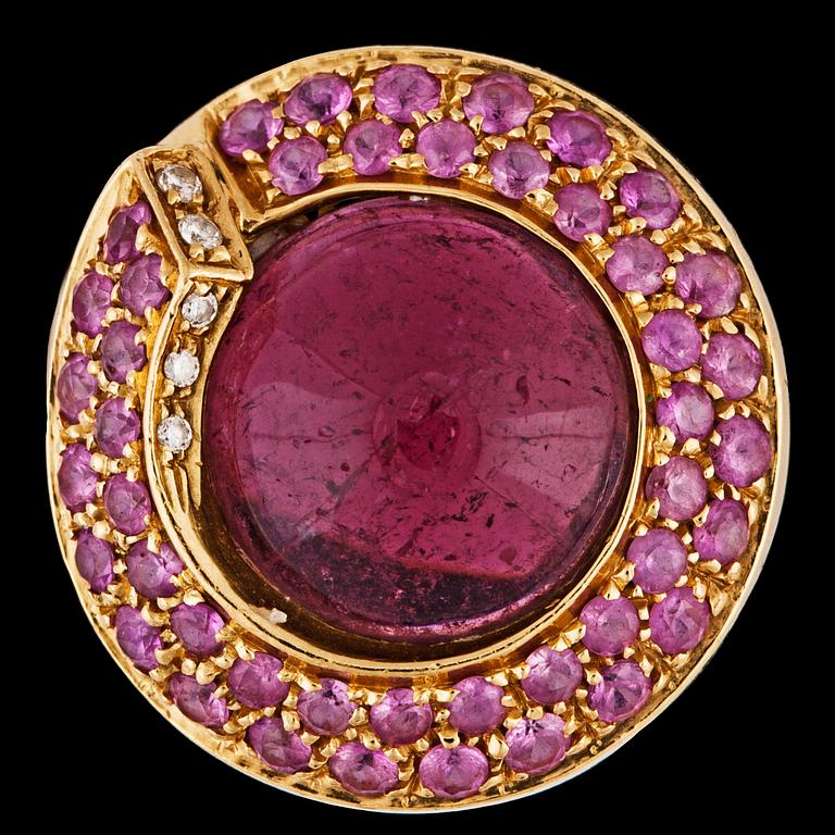 A pink cabochon cut tourmaline, pink sapphire and brilliant cut diamond ring.