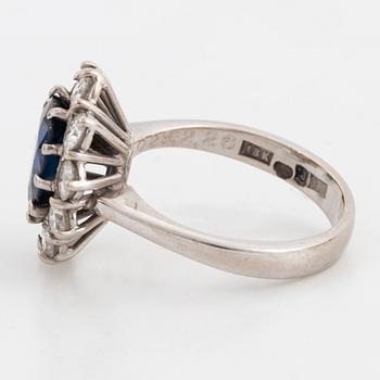 Sapphire and brilliant-cut diamond cluster ring.