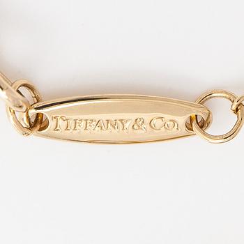Tiffany & Co, Elsa Peretti, kaulakoru, "Diamonds by the Yard", 18K kultaa ja kaksi briljanttihiottua timanttia.