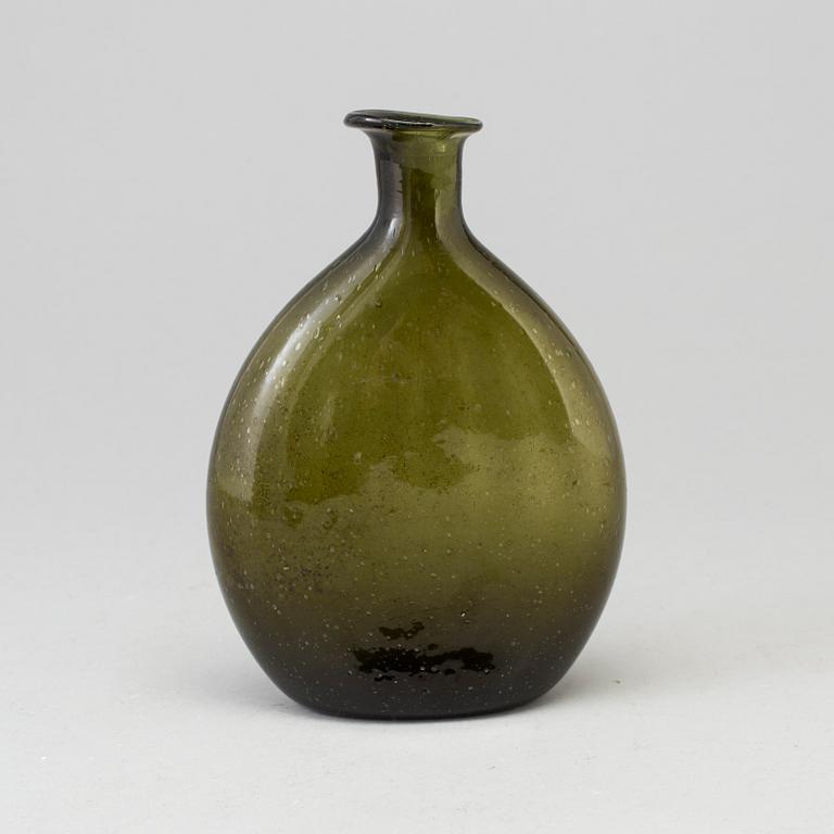 A 18th century glass bottle.
