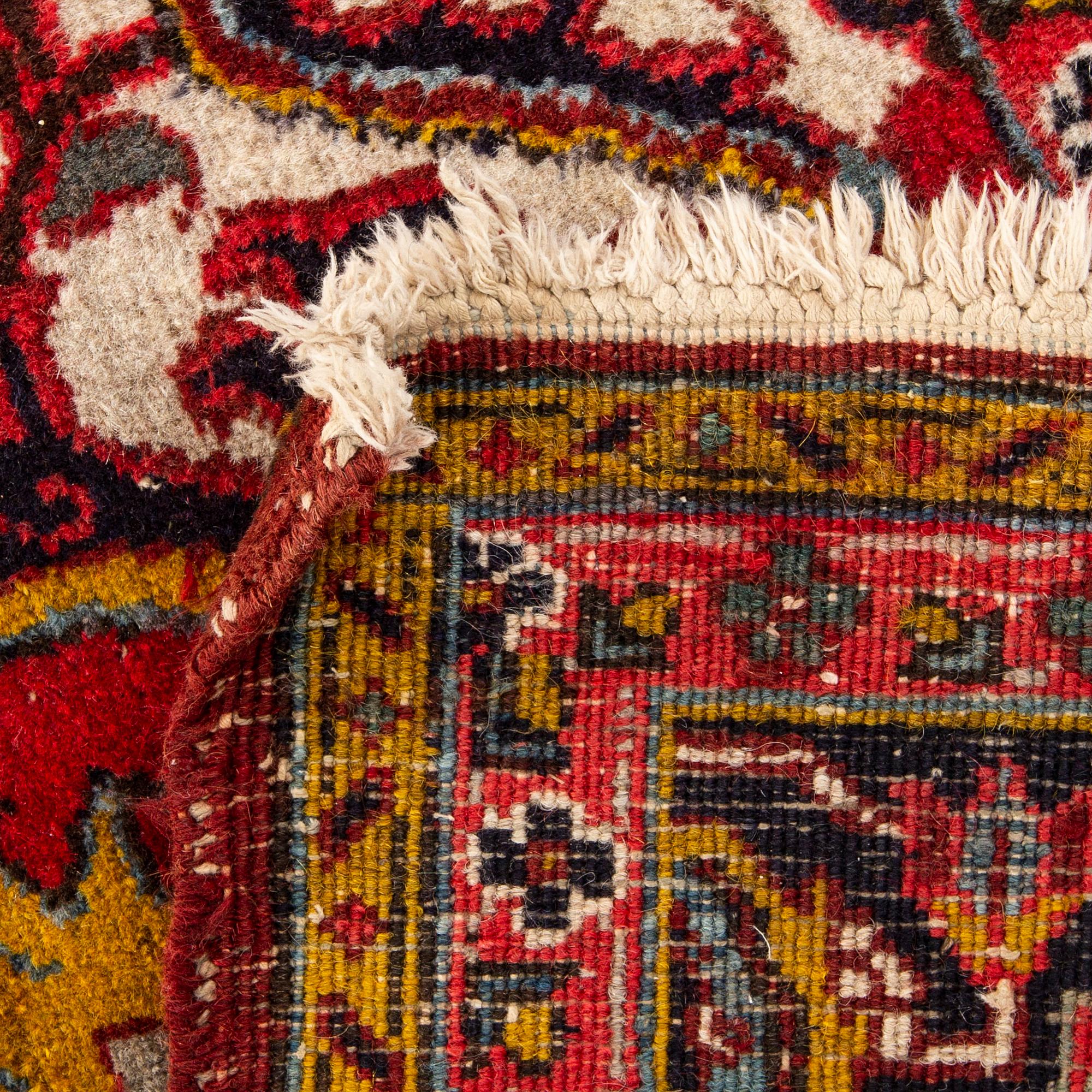 An old Heriz carpet ca 348 x 246 cm.