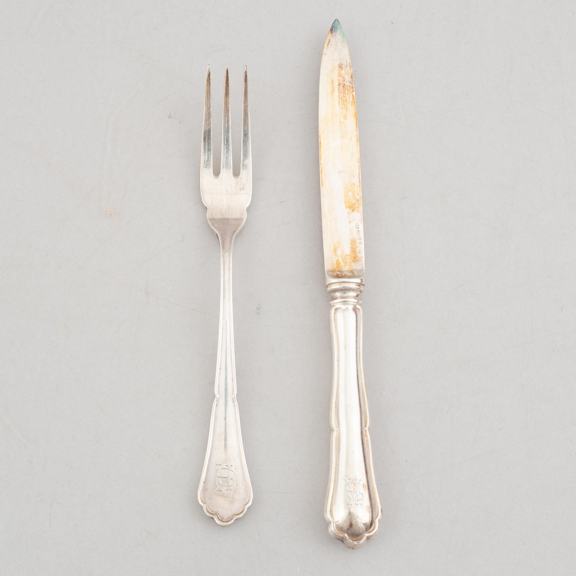 A set of 24 silver fruit knives and forks by Hanna Persson, Kristianstad, Sweden, 1923.