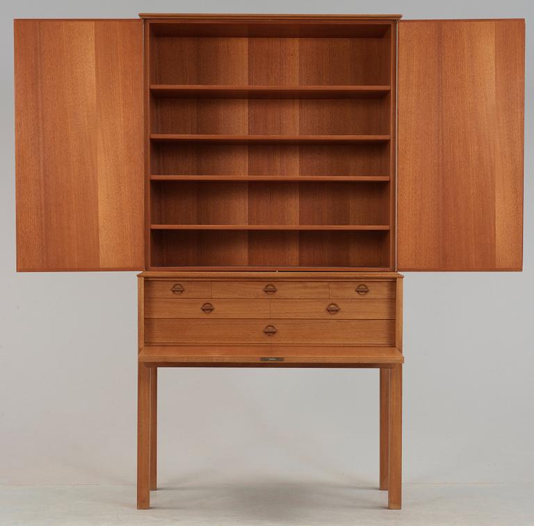 A Carl Malmsten mahogany cabinet with inlays of different types of wood, signed and dated 1958.