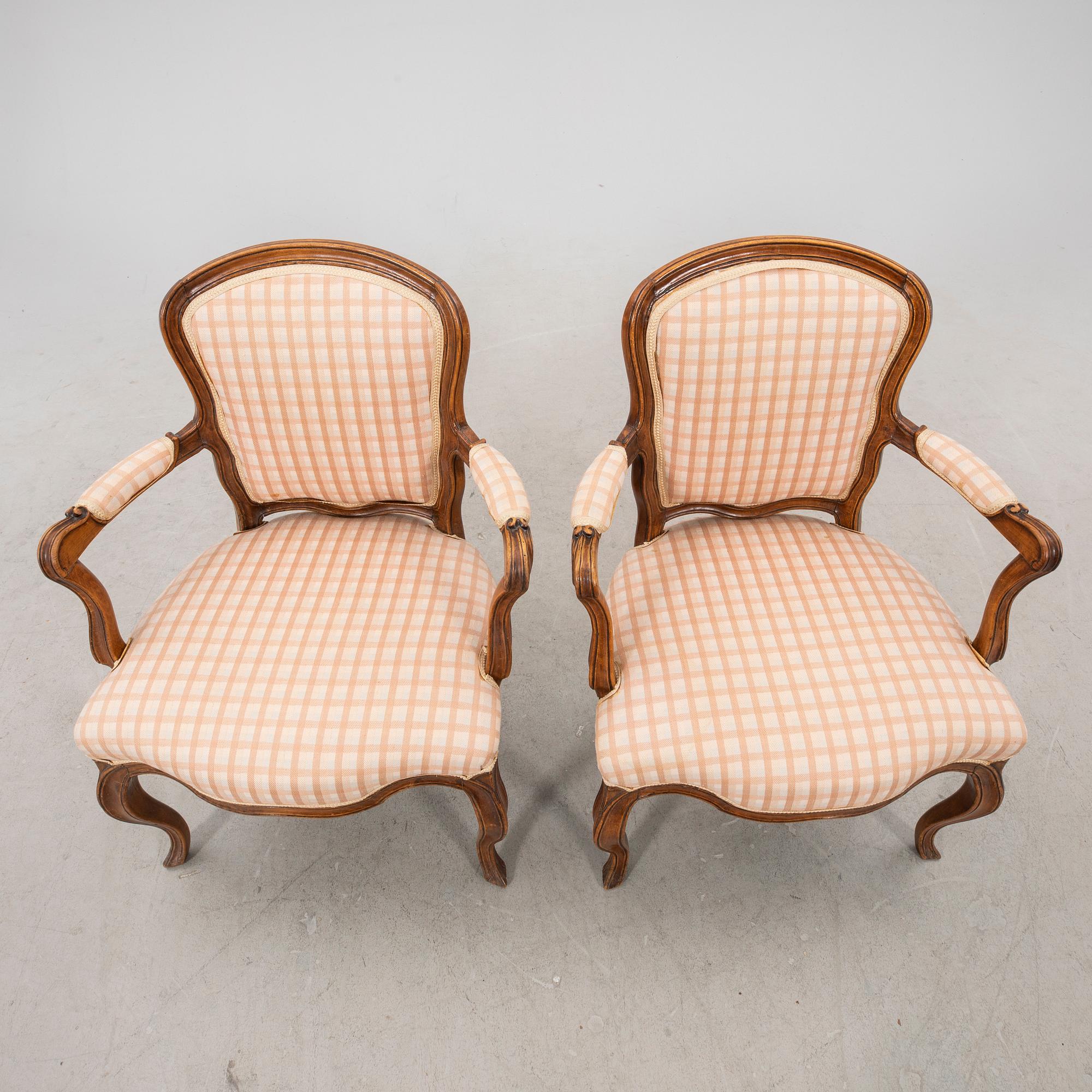 A pair of 19th century Rococo style armchairs.
