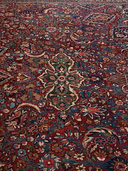 A CARPET,  a semi-antique Mashad, ca 544,5 x 356 cm, signed "Work by Makhmalbaf".