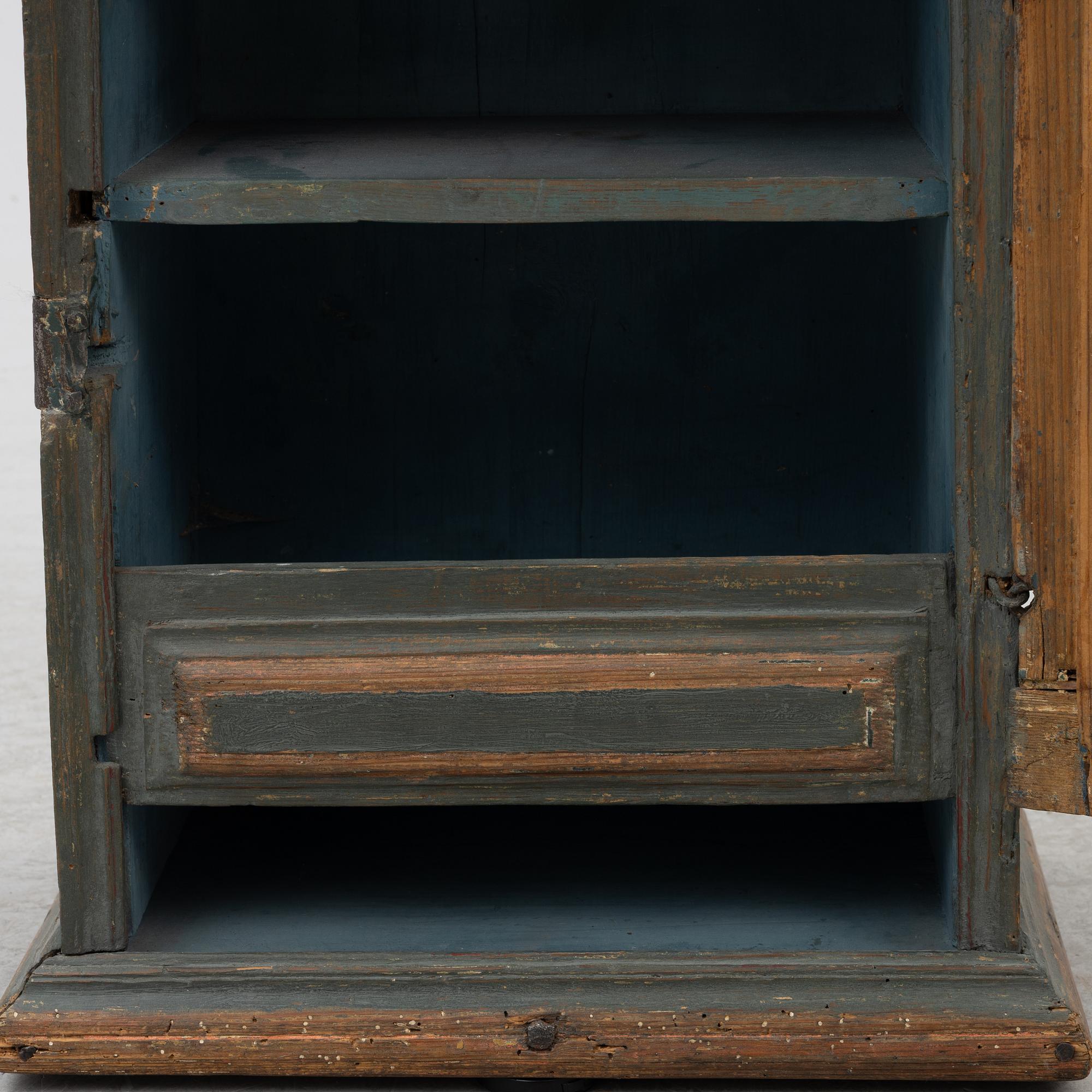 A painted wall cabinet, 19th century.