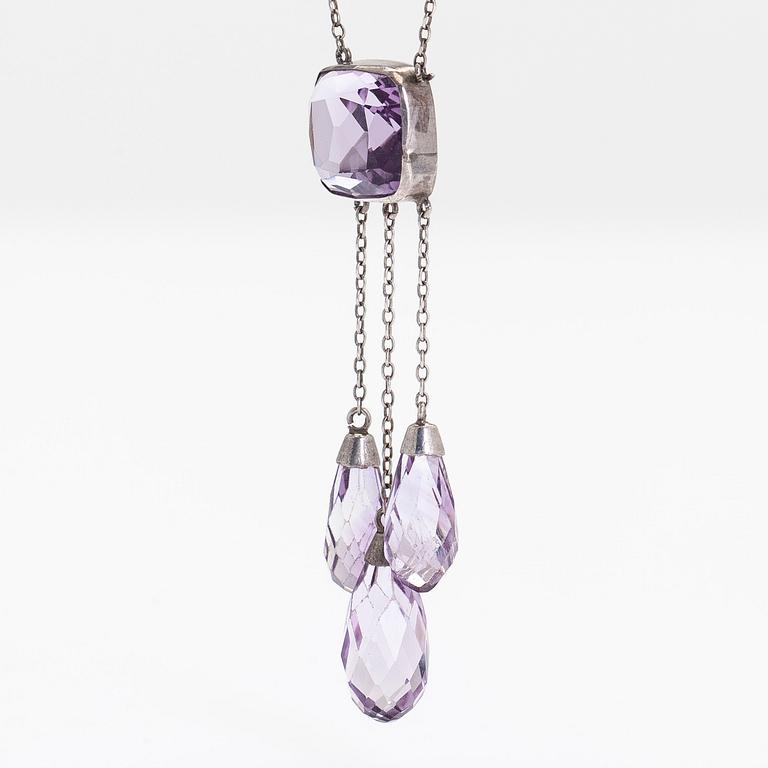 A silver and faceted amethyst necklace.