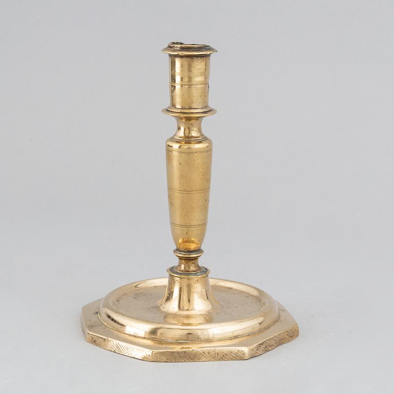 A 17th century bronze candlestick.