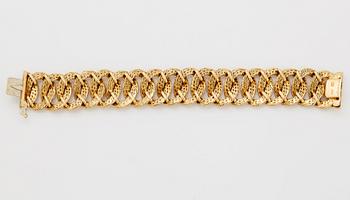 Georges L'Enfant an 18K gold demi parure comprising a necklace, a bracelet and a ring.
