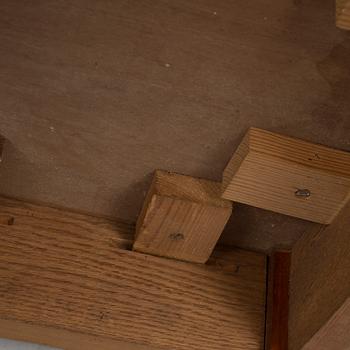 A mid 20th century mahogany veneered table from Nordiska Kompaniet (NK).