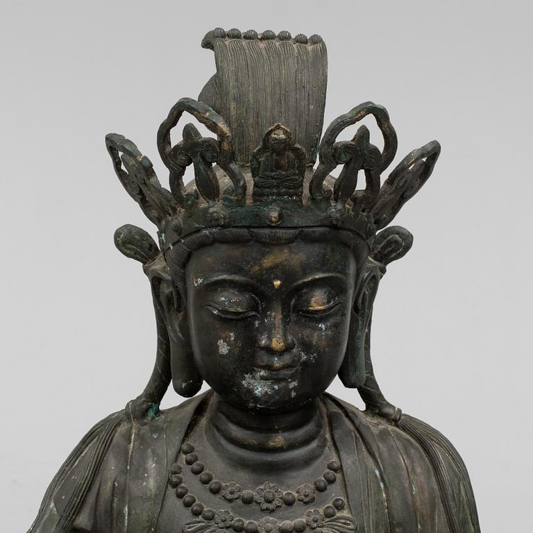 A mid 20th century metal Guan Yin figurine, China.
