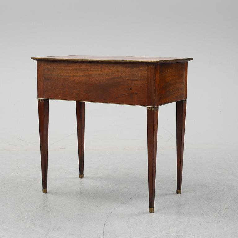 A late Gustavian mahogany tabld with drawers, end of the 18th Century.