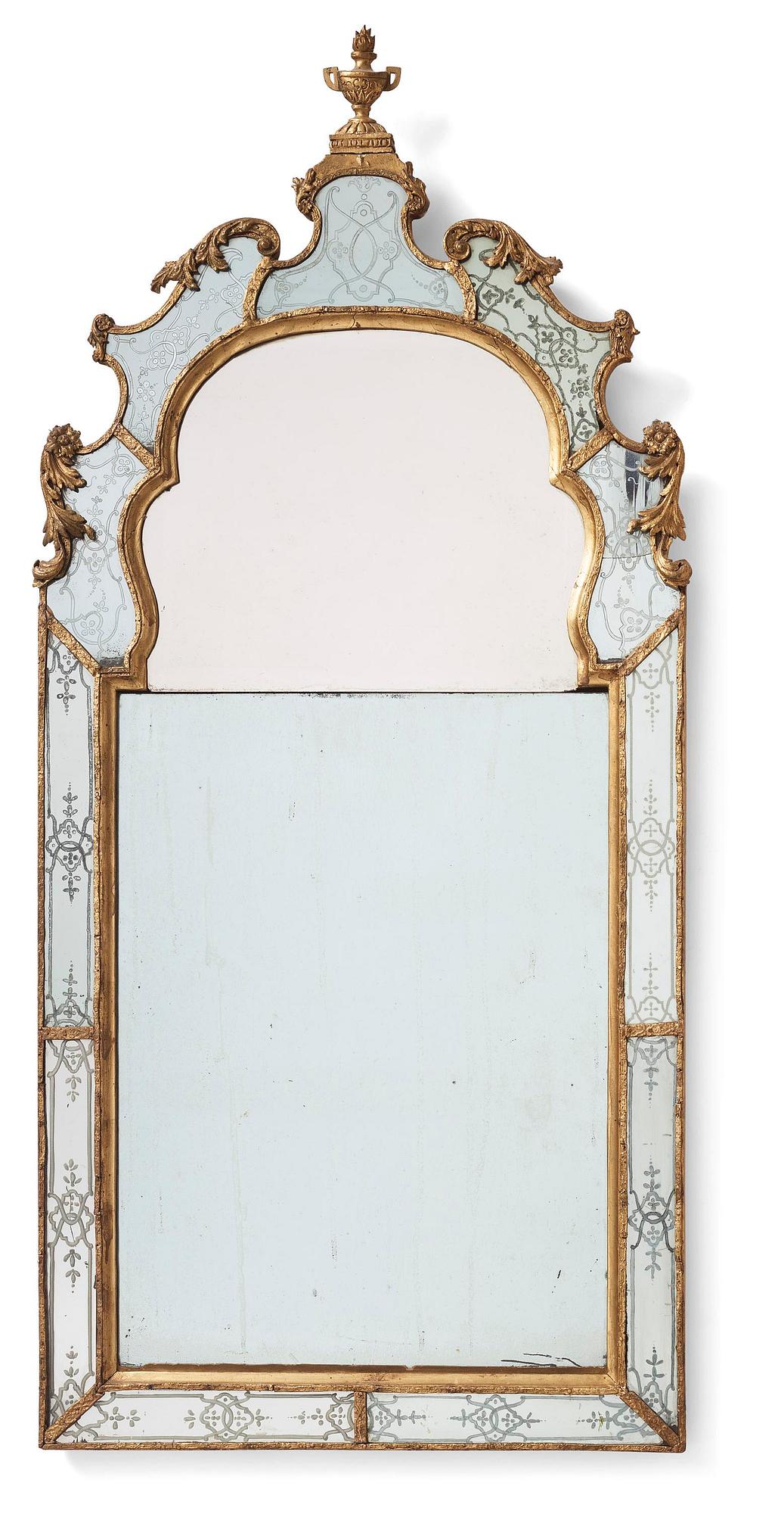 A Baroque gilt-lead and engraved glass mirror in the manner of Burchard Precht, early 18th century.