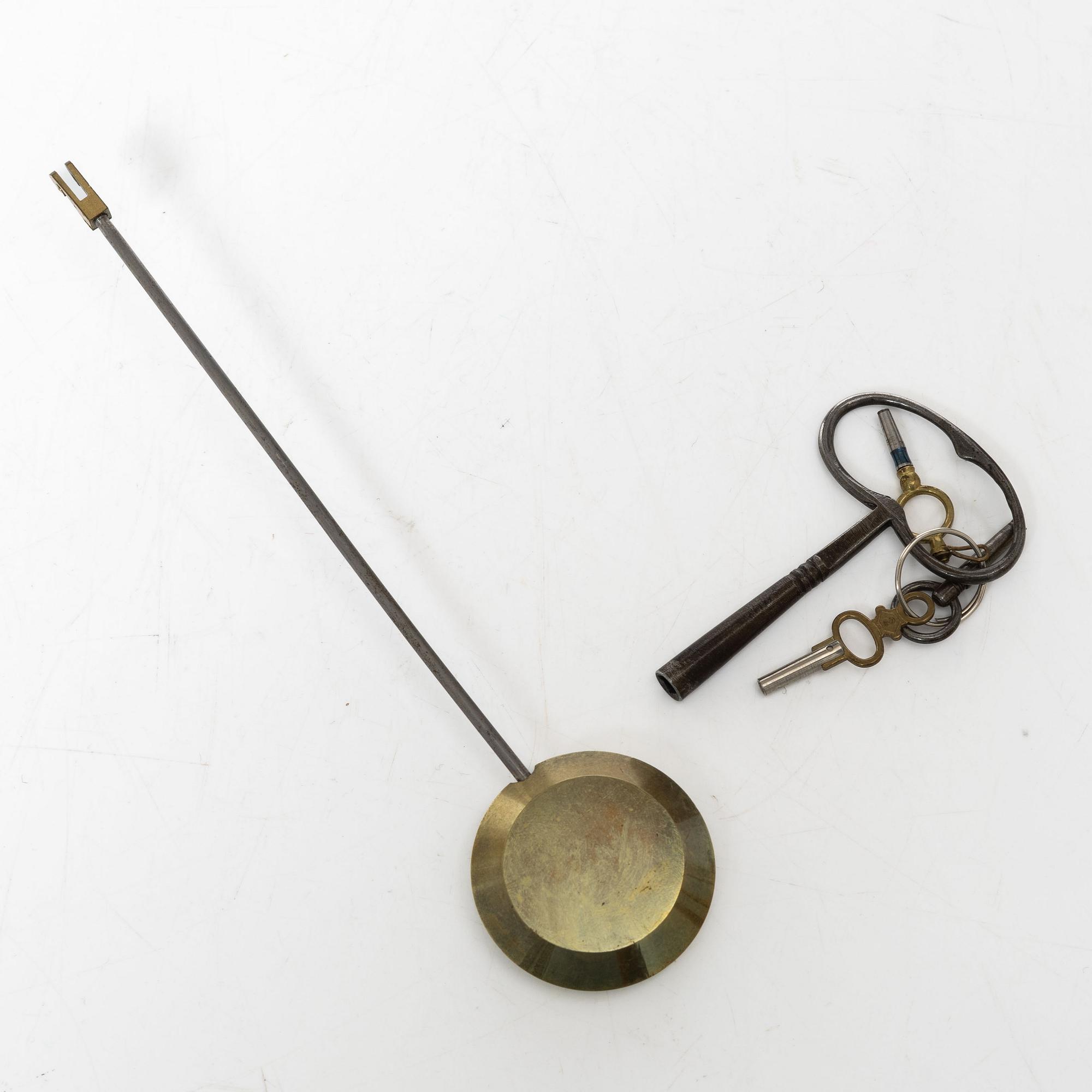A French Louis XVI-style mantel clock and a pair of candelabra, late 19th Century.