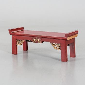 A Chinese 20th century painted wooden bench.