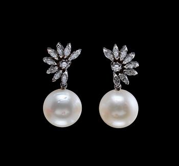 A PAIR EARRINGS, soth sea pearls 13,7 mm, navette- and brilliant cut diamonds c. 1.74 ct. 18K white gold. Weight 15,5 g.