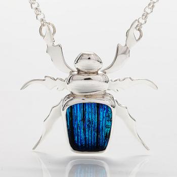 A sterling silver necklace "Blue beetle" with dichroic glass. Ru Runeberg 2018.