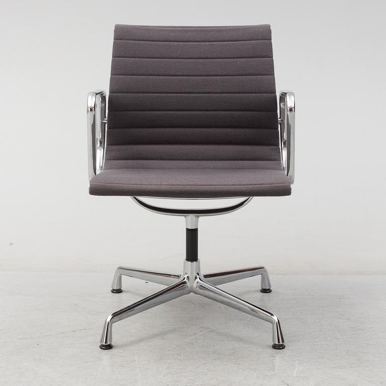 An 'EA 104 Swivel' armchair by Charles & Ray Eames, Vitra, 2007.