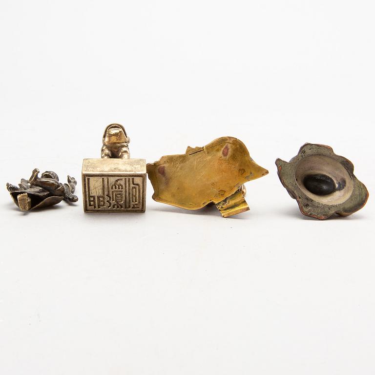 A set of four bronze giurines, a wooden bowl, two stands and one porcelain cup with stand, 20th century.