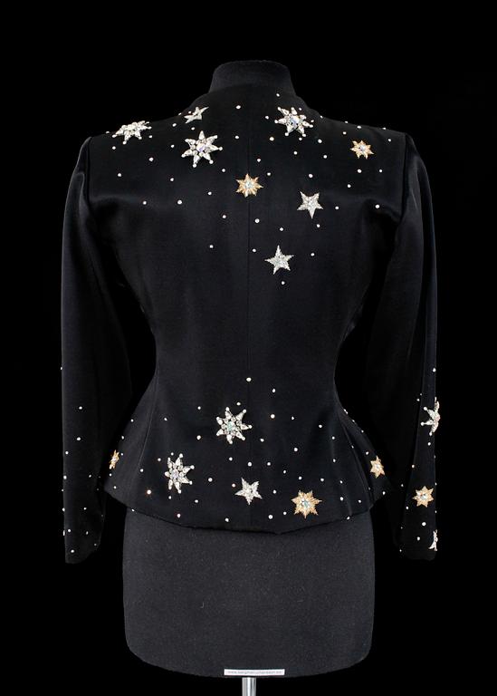 A black evening jacket by Yves Saint Laurent.