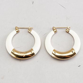 A pair of Dolce & Gabbana earrings.