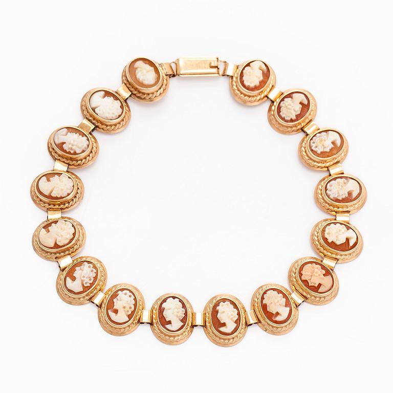 A 14K gold and shell cameo jewelry set, bracelet, pendant/brooch and ring.