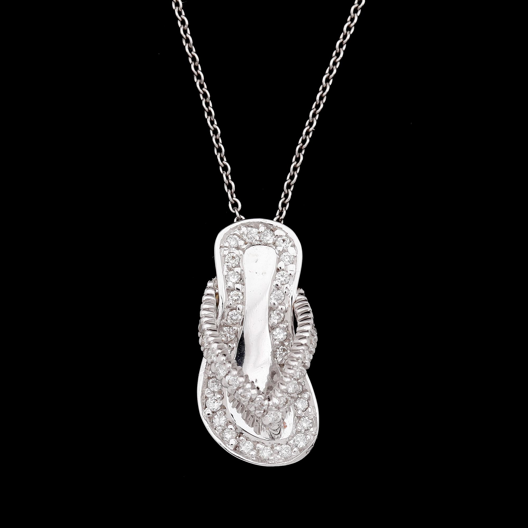 PENDANT, shape of small sandal, brilliant cut diamonds, tot. app. 0.45 ct, underneath small ruby.