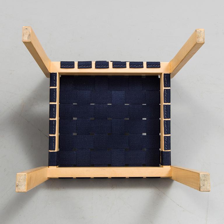 Four of Alvar Aalto birch tree and canvas chairs, model 611 by Artek.