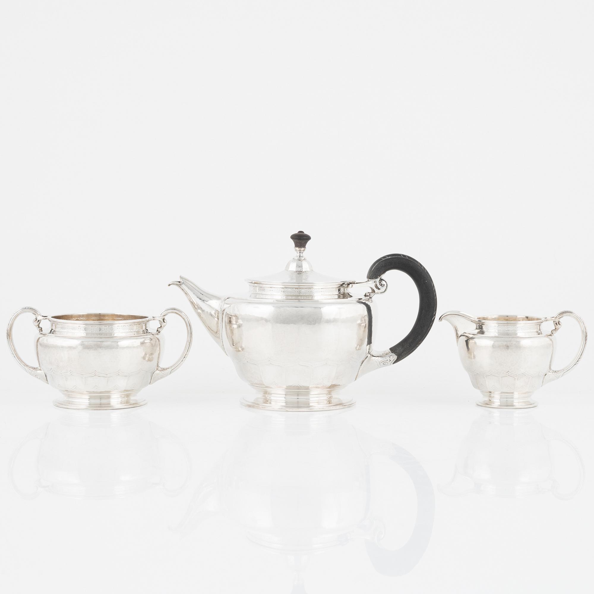 A Norwegian Silver Teapot, Sugar Bowl and Creamer, mark of David Andersen, Oslo circa 1923.