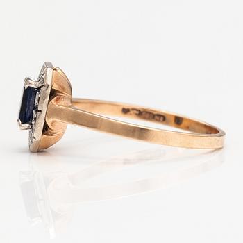 A 14K gold ring with a sapphire and dimaonds ca. 0.10 ct in total. Matti Valkila, Helsinki 1990.