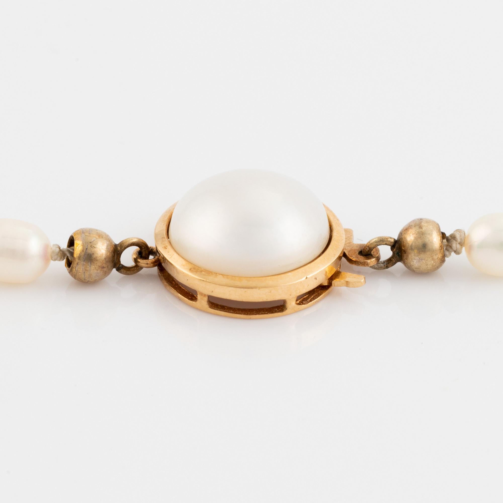 Cultured freshwater pearl necklace, with navette cut diamond and brilliant cut diamonds.
