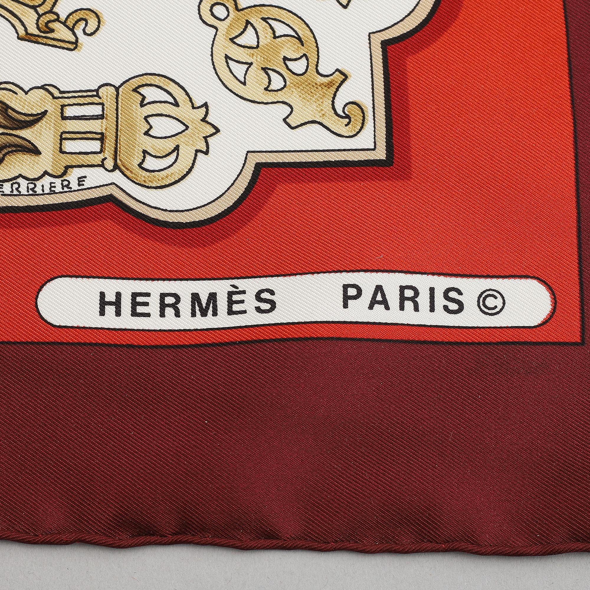 Hermès, a 'Les Eperons' silk scarf.