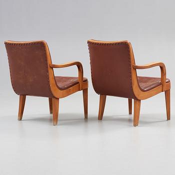 A pair of Swedish Modern birch and brown leather armchairs, probably by Axel Larsson, Bodafors, 1930's.