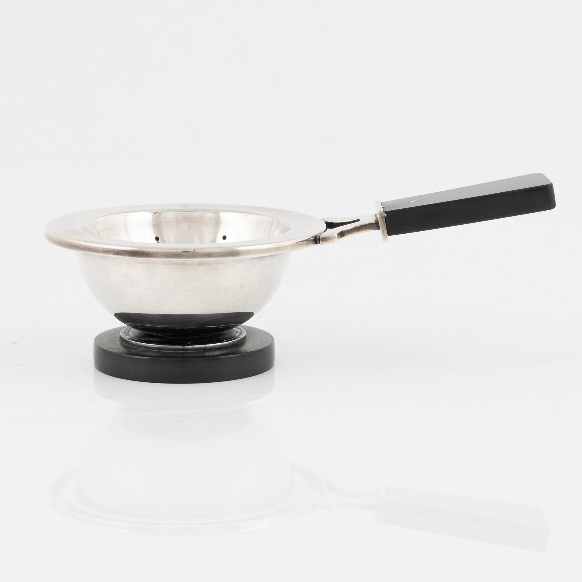 A silver tea strainer with stand, Cohr, Denmark, 1930's.