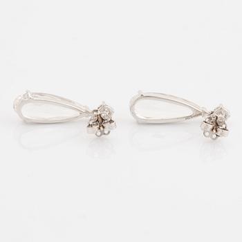 White topaz and brilliant cut diamond earrings.