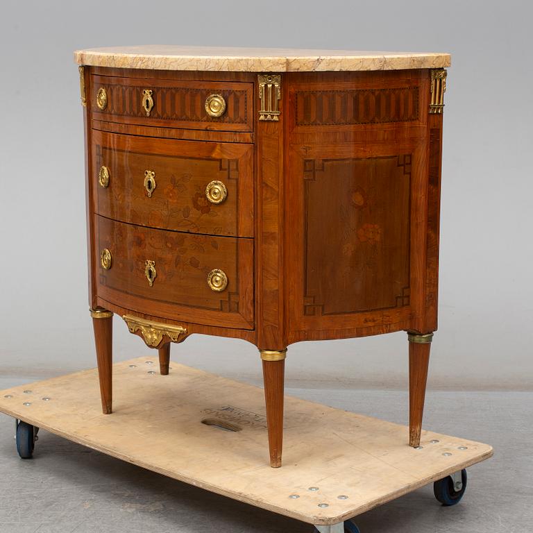 A Louis XVI-style 20th century commode.