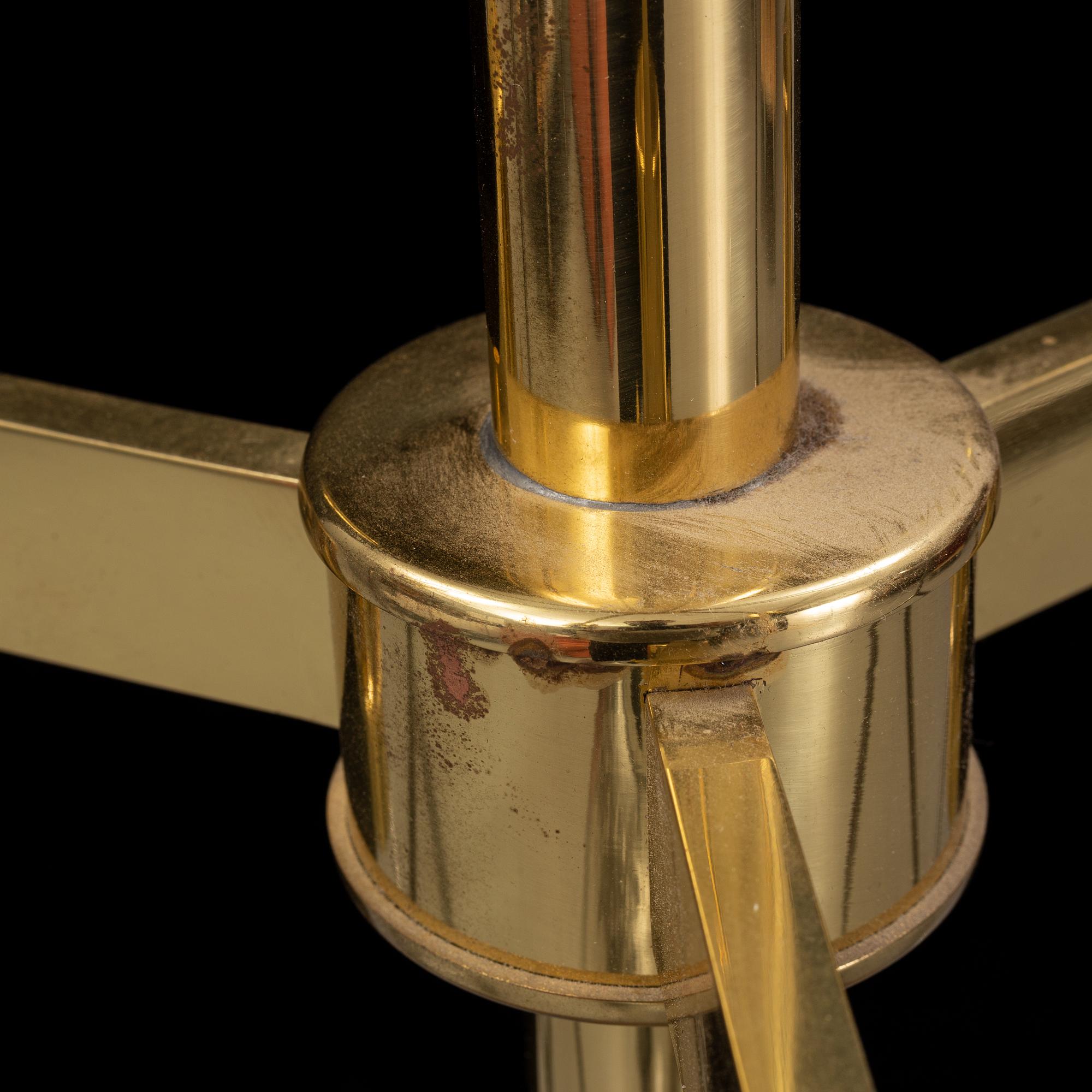 A brass chandelier with two glass globes by Hans-Agne Jacobsson, Markaryd.