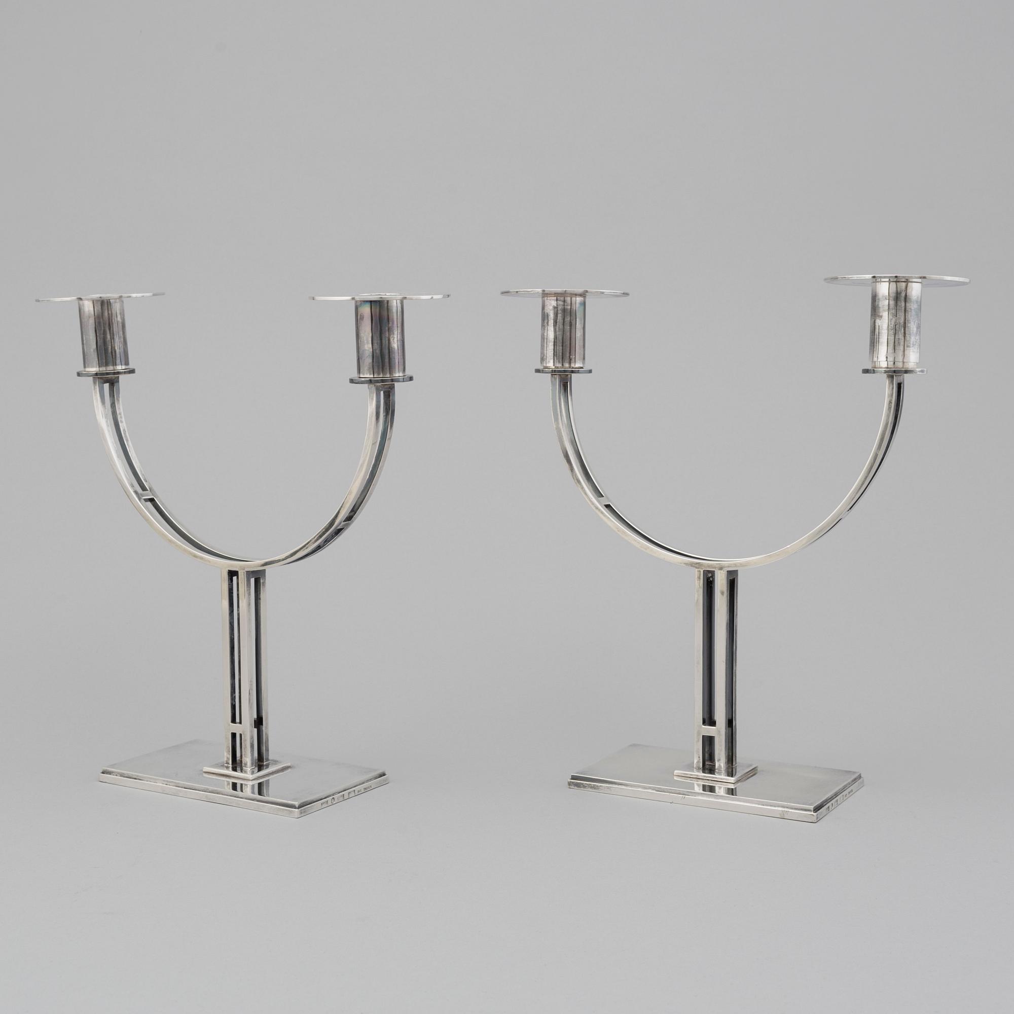 A pair of Klas-Göran Tinbäck two light sterling silver candelabra. Stockholm, 1989.
