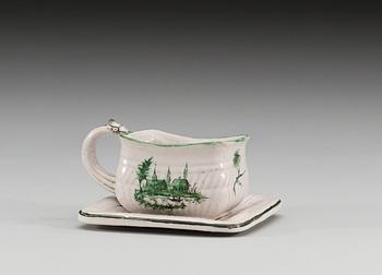 A faience cup with stand, signed Proskau, presumably Polish, ca 1800.