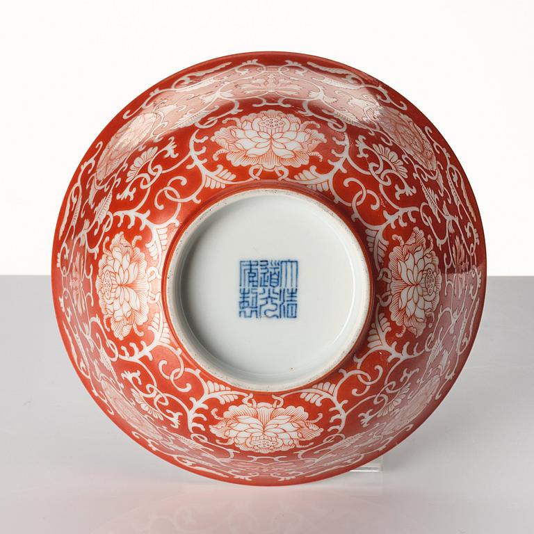 A coral red reverse decorated lotus bowl, Qing dynasty with Daoguang mark in underglaze blue.