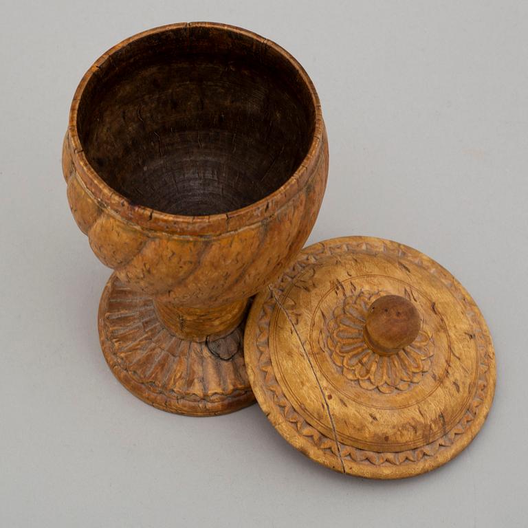 Five carved wood items, including a cup and a miniature bottle, 19th century.