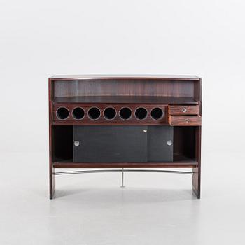 A danish 1960's Smith & Dyrlund bar with three barstools.