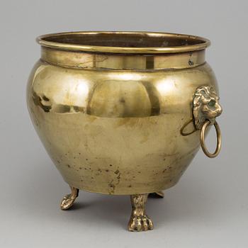 A 19th century brass champagne cooler.