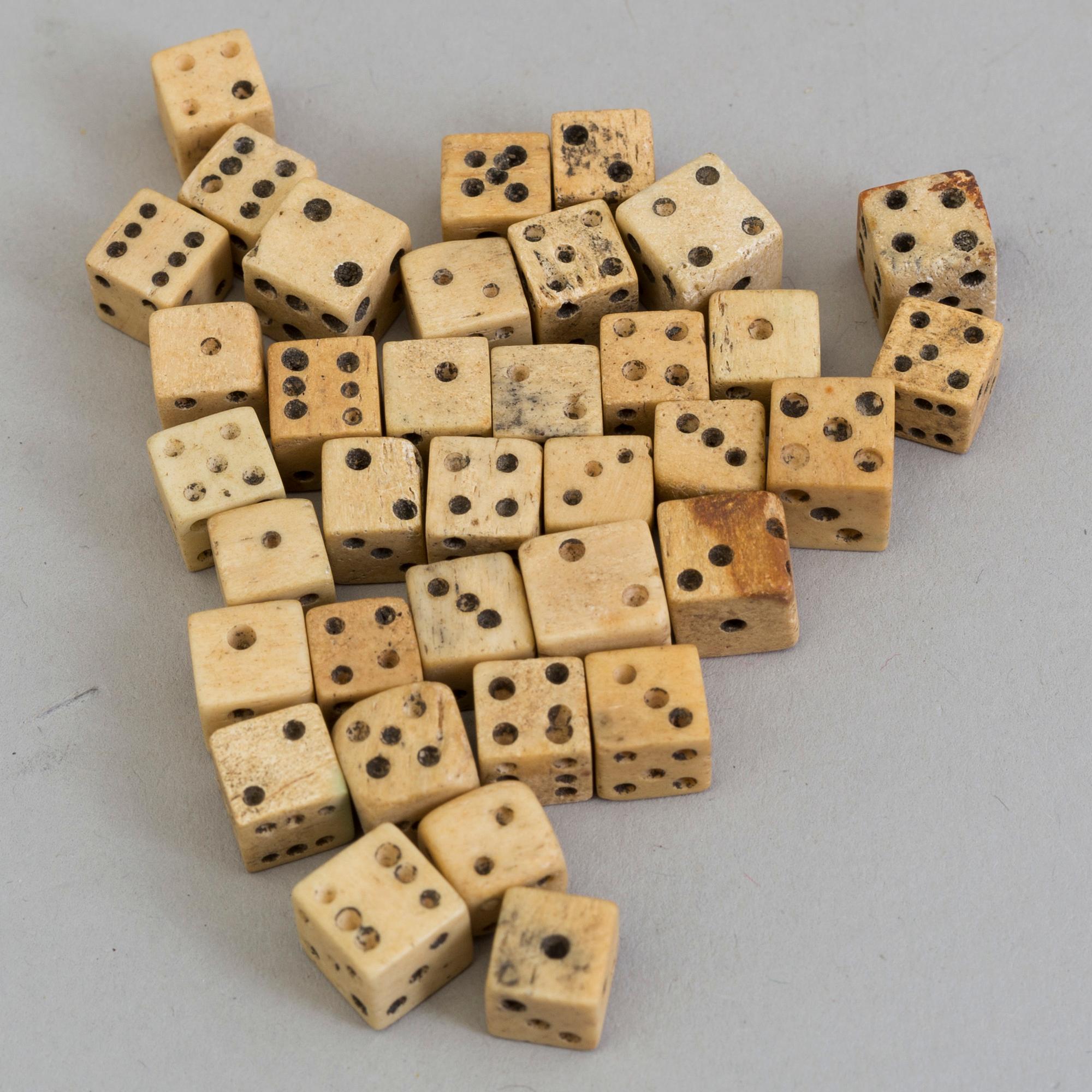 36 MINIATURE BONE DICE, 19th century.